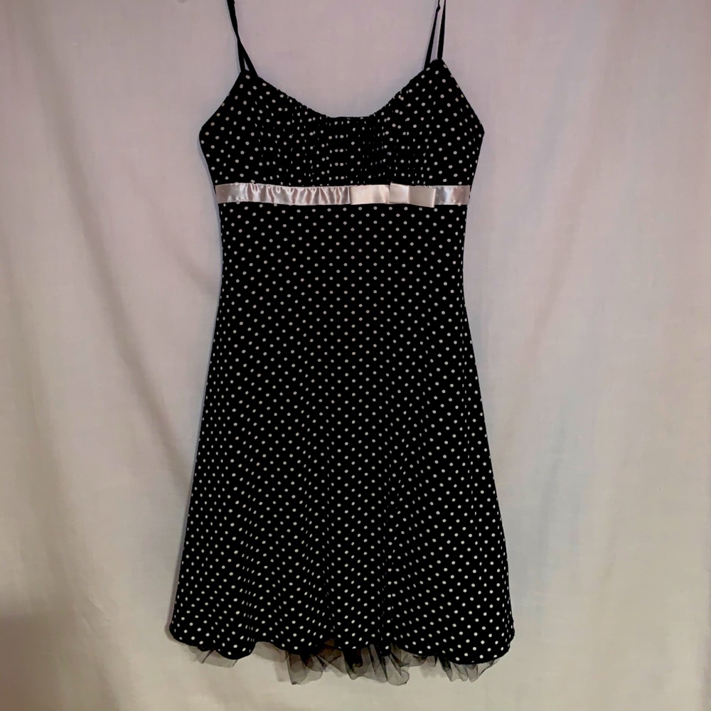 Black and white polkadot dress.